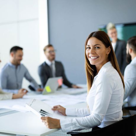 Group of business people collaborating on project in office